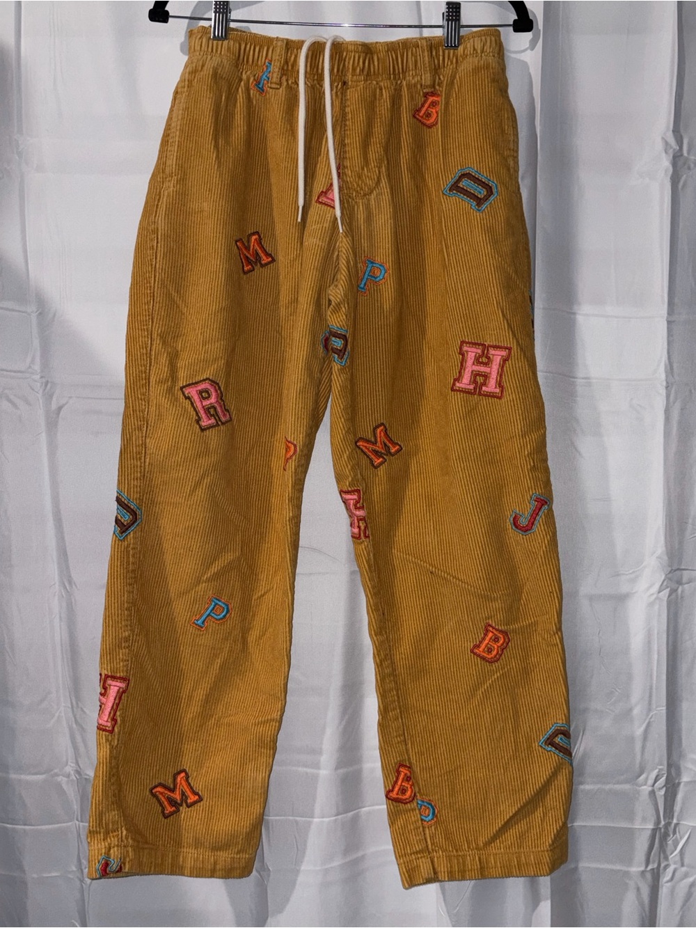 Urban Outfitters Mustard Corduroy Pants with Multicolor Letter Patches